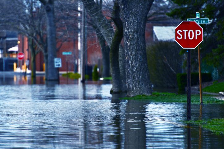 Flooded residential street at a stop sign